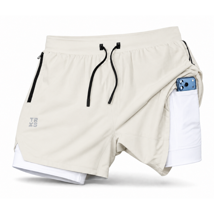 TROS Resilience PDP 2026-05 · Short Resilience - Stone Calza Blanca · 03 · 03 flat lay detail / phone / toallero