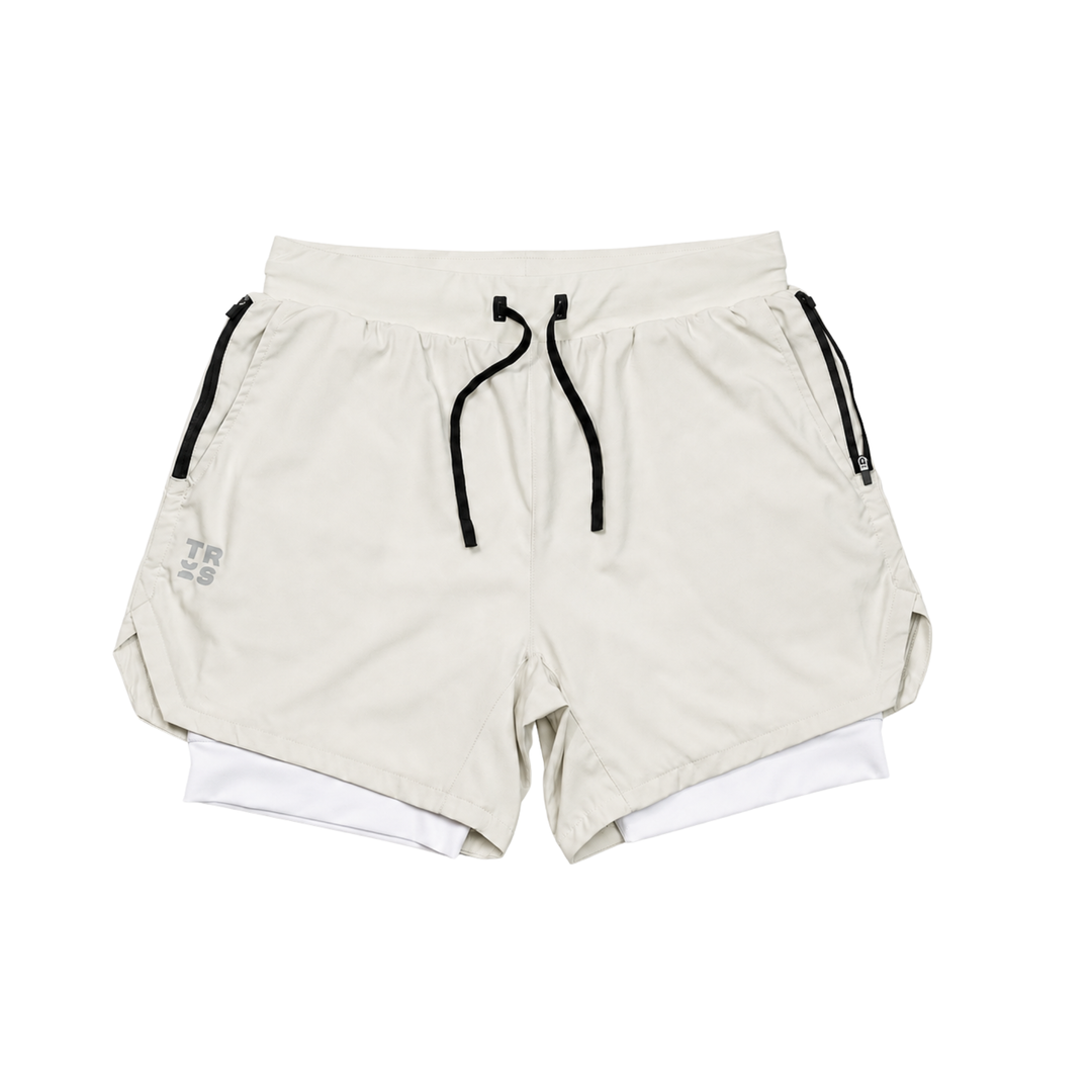 TROS Resilience PDP 2026-05 · Short Resilience - Stone Calza Blanca · 01 · 01 hero flat lay product