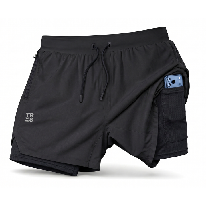 TROS Resilience PDP 2026-05 · Short Resilience - Negro Calza Negra · 03 · 03 flat lay detail / phone / toallero