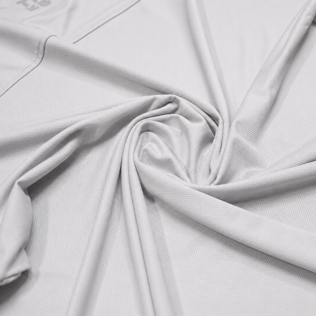 TROS Resilience PDP 2026-05 · Polera Resilience - Gris · 07 · 07 fabric detail