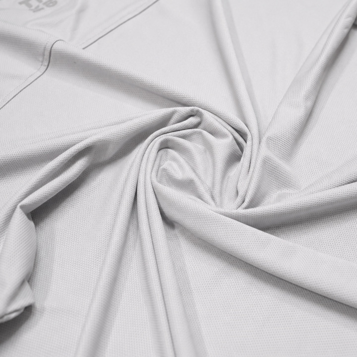 TROS Resilience PDP 2026-05 · Polera Resilience - Gris · 07 · 07 fabric detail