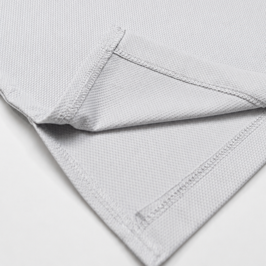 TROS Resilience PDP 2026-05 · Polera Resilience - Gris · 06 · 06 hem/stitch detail