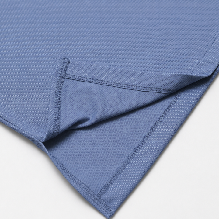 TROS Resilience PDP 2026-05 · Polera Resilience - Slate · 05 · 05 hem/stitch detail