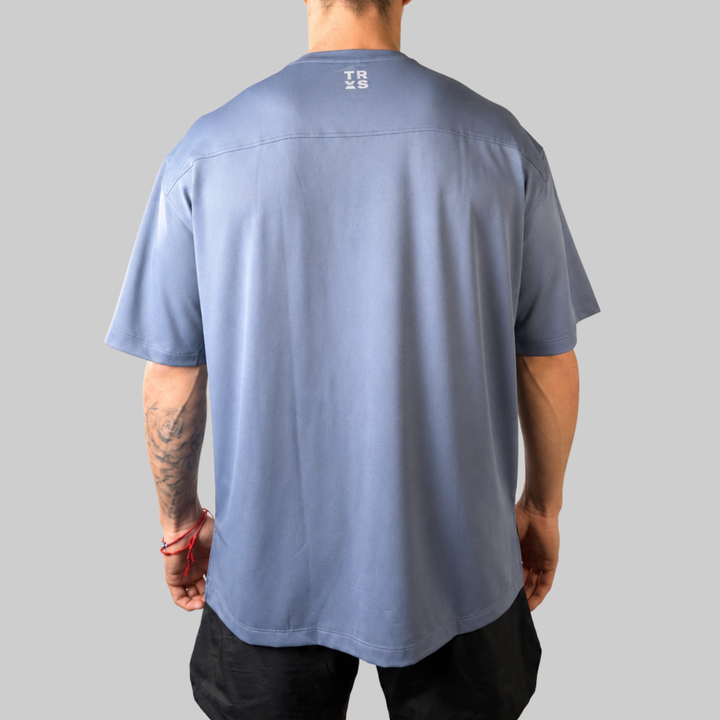 TROS Resilience PDP 2026-05 · Polera Resilience - Slate · 03 · 03 model back
