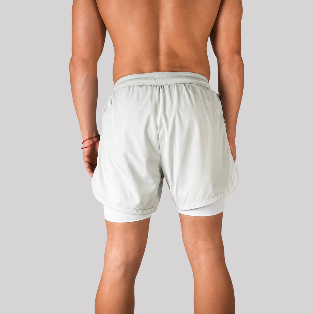 TROS Resilience PDP 2026-05 · Short Resilience - Stone Calza Blanca · 04 · 04 model back clean rear
